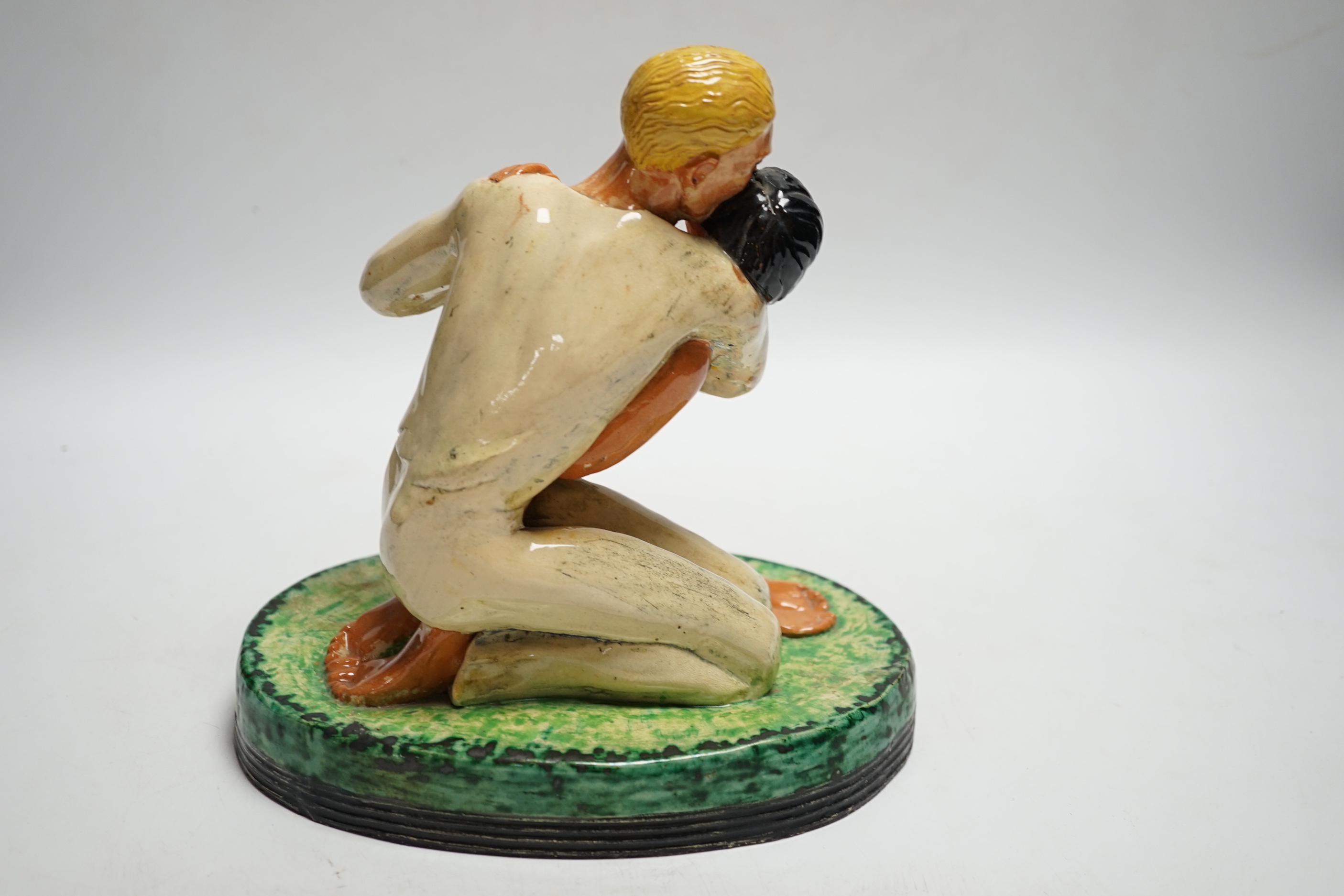 Dunstan Ford Smith, dated 1926, a pottery figure group, 21cm high